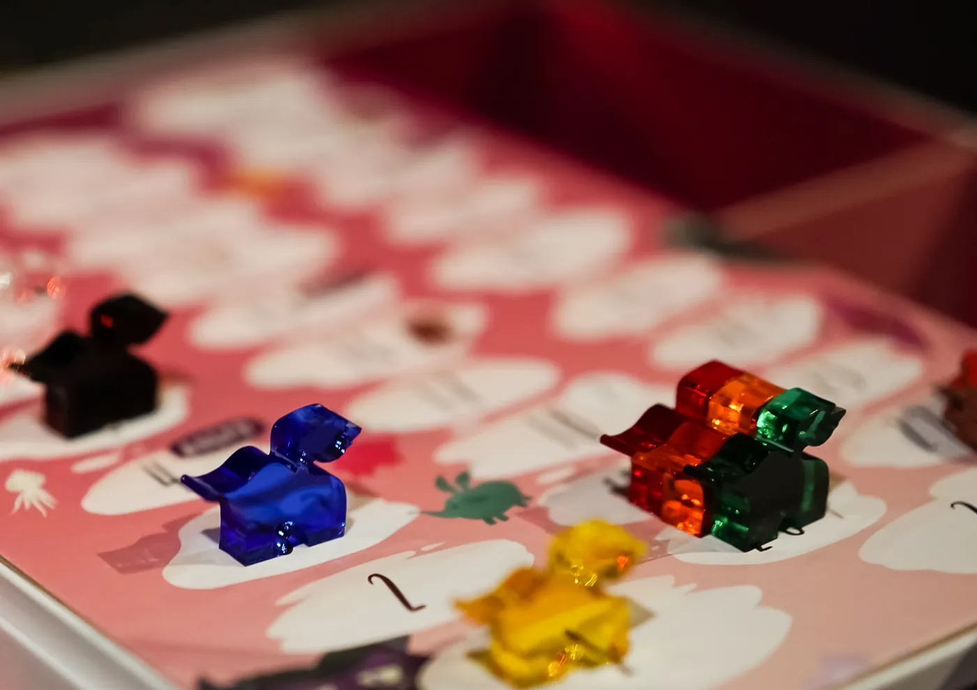 Imaginarium board with coloured playing pieces